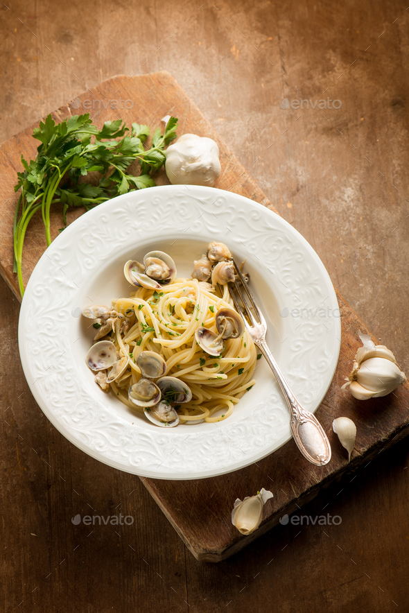 spaghetti pasta with clam garlic and parsley Stock Photo by